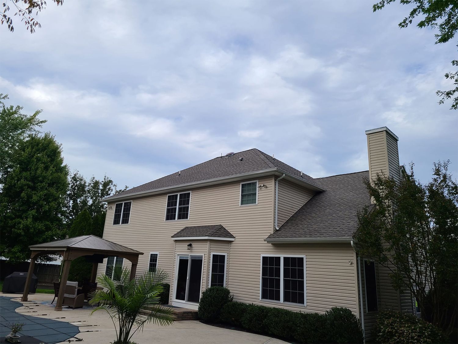 A large house with a gazebo in front of it