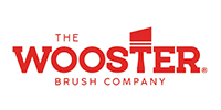 Logo for The Wooster Brush Company in red, featuring a stylized brush.