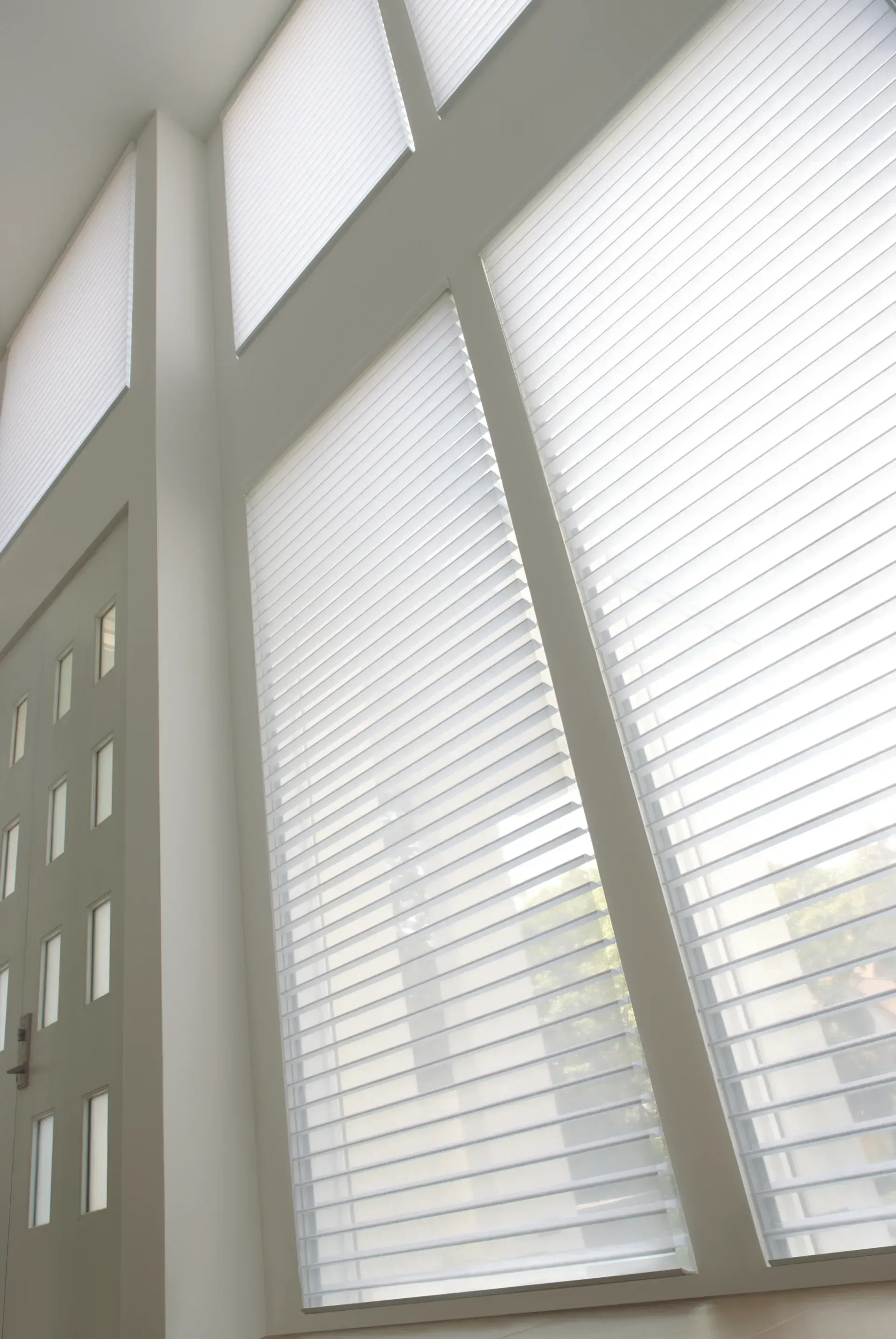 A close up of a window with blinds on it