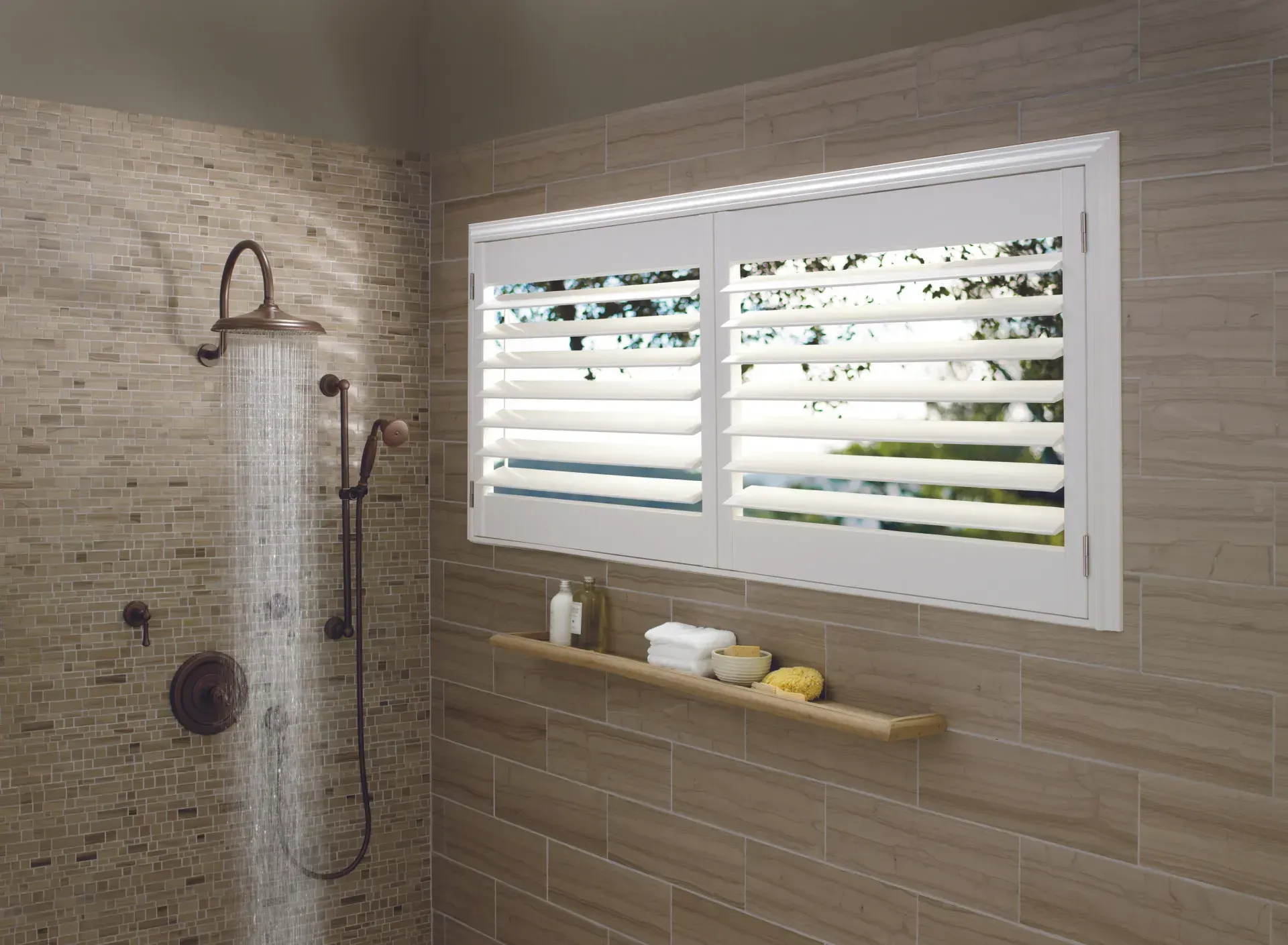 A bathroom with a shower and a window with shutters.