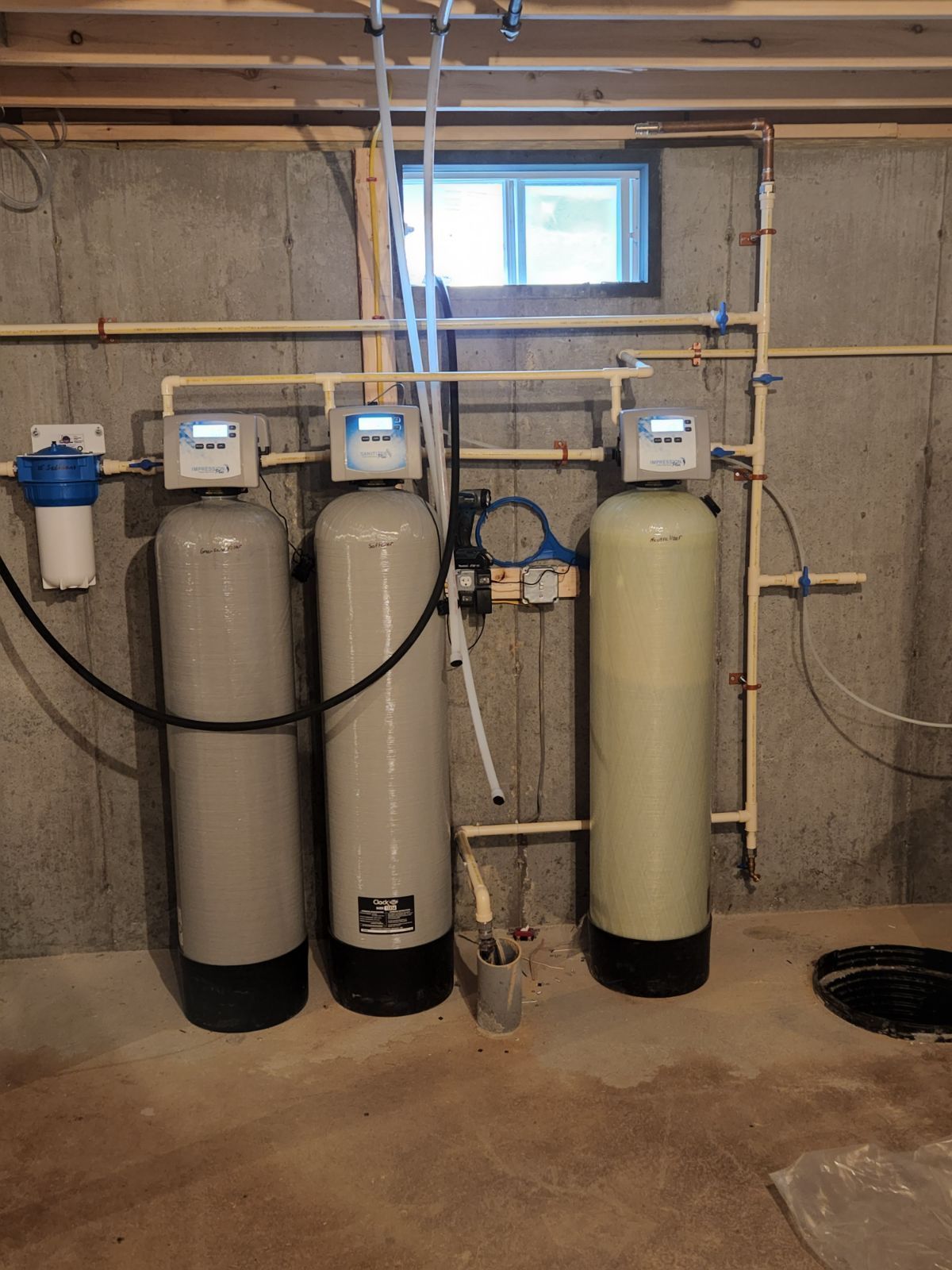 two gray tanks and one cream-colored tank