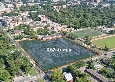 Aerial view of a 4.62-acre vacant lot outlined in orange, surrounded by homes and trees.