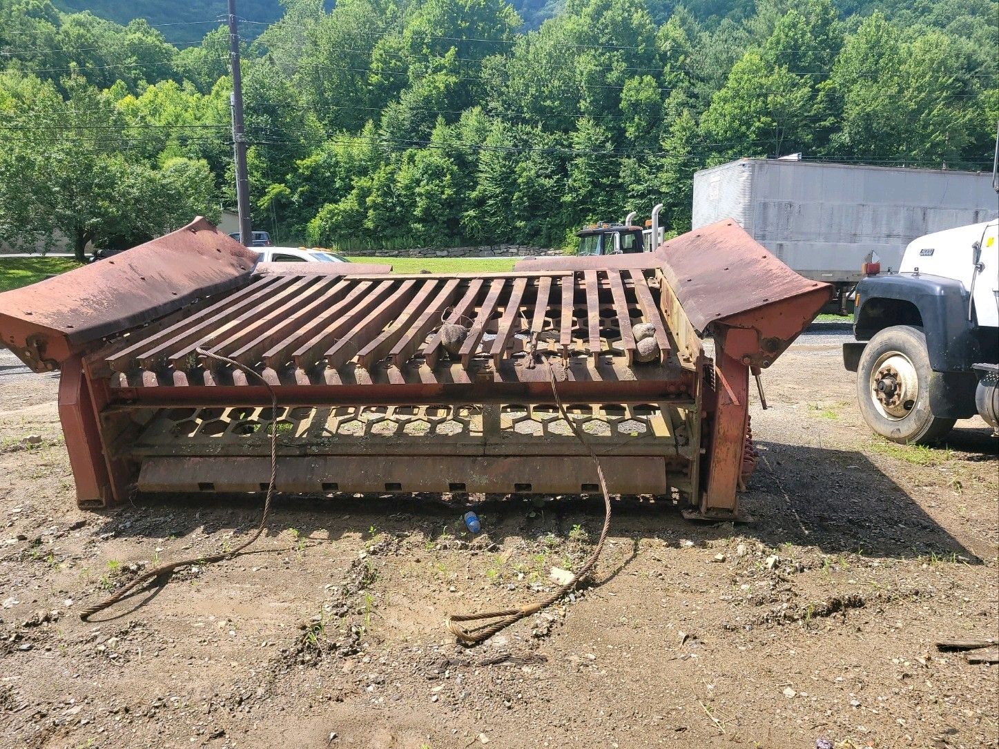 Sand and rock screen with engine and pumps