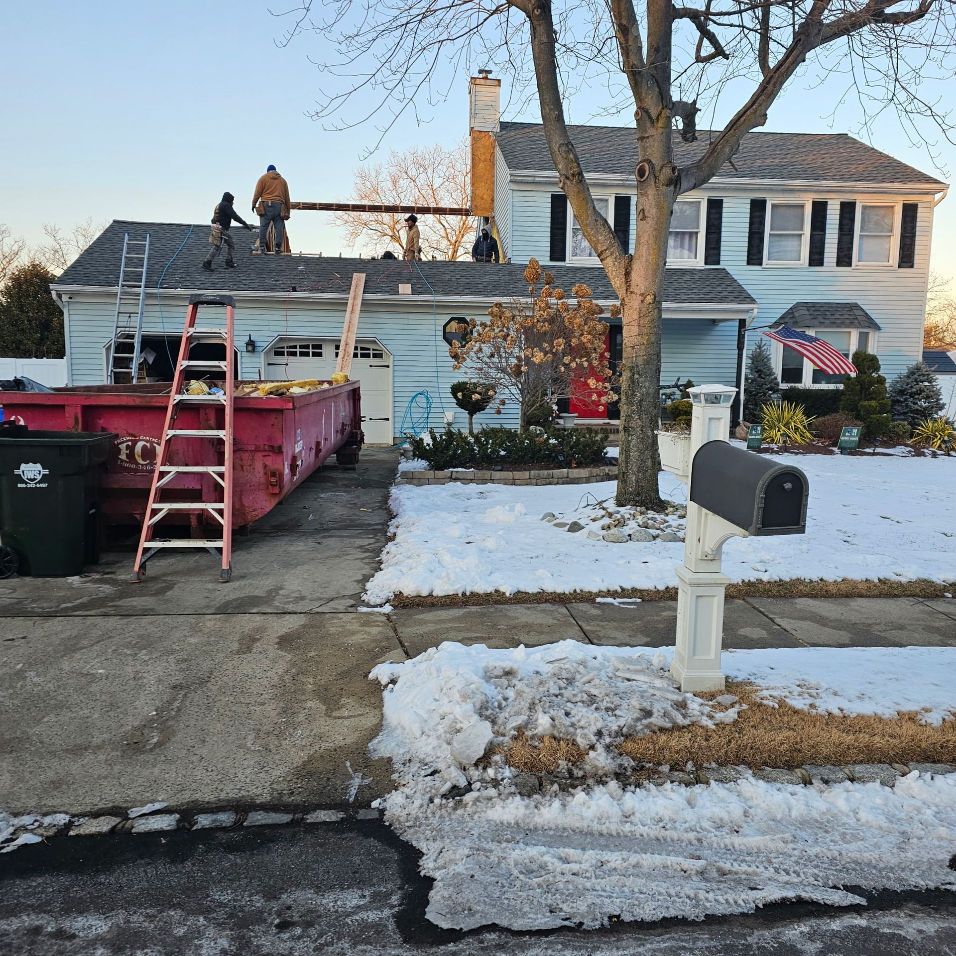 A house with a mailbox in front of it
