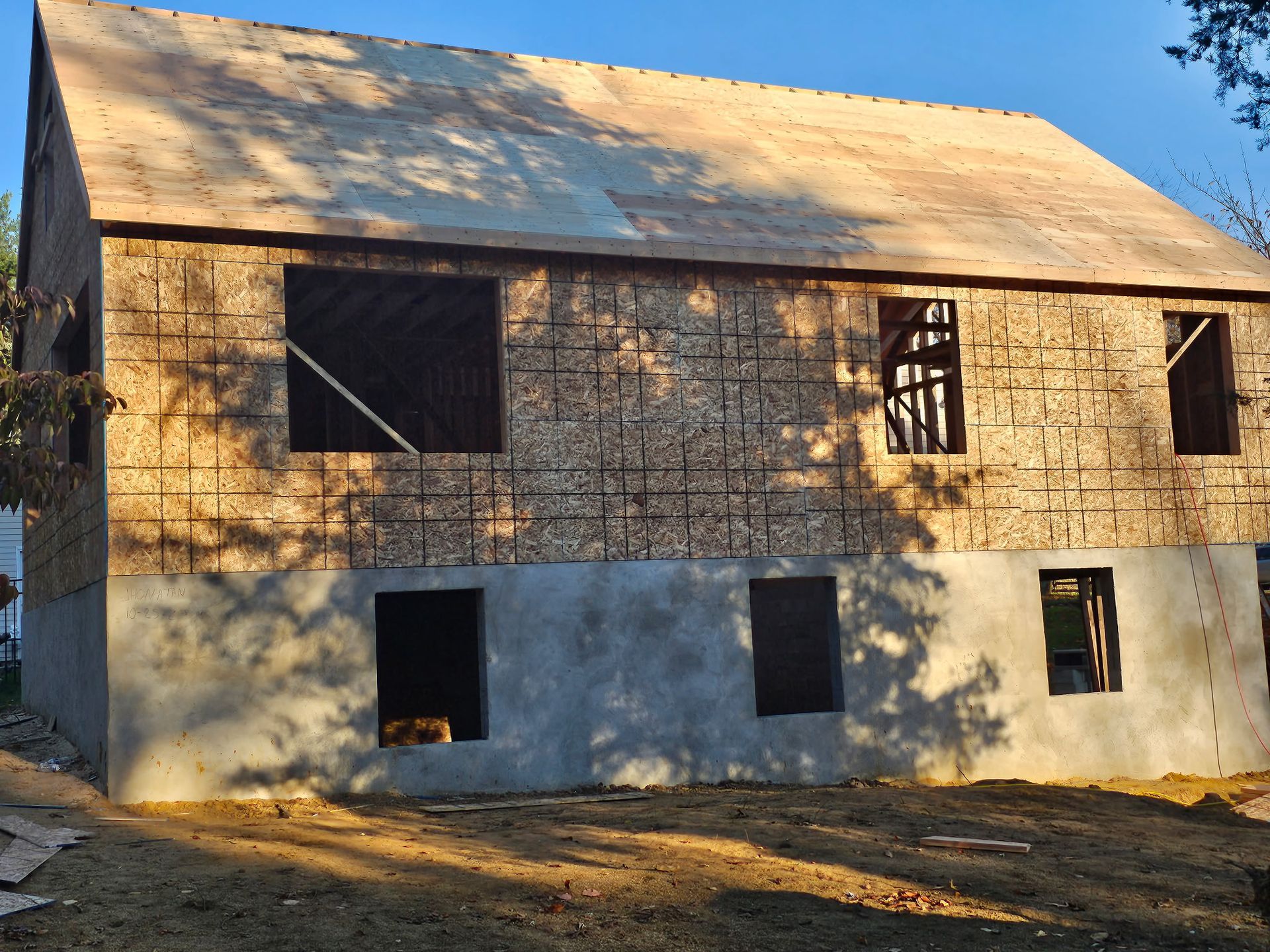 A house that is being built with a wooden roof