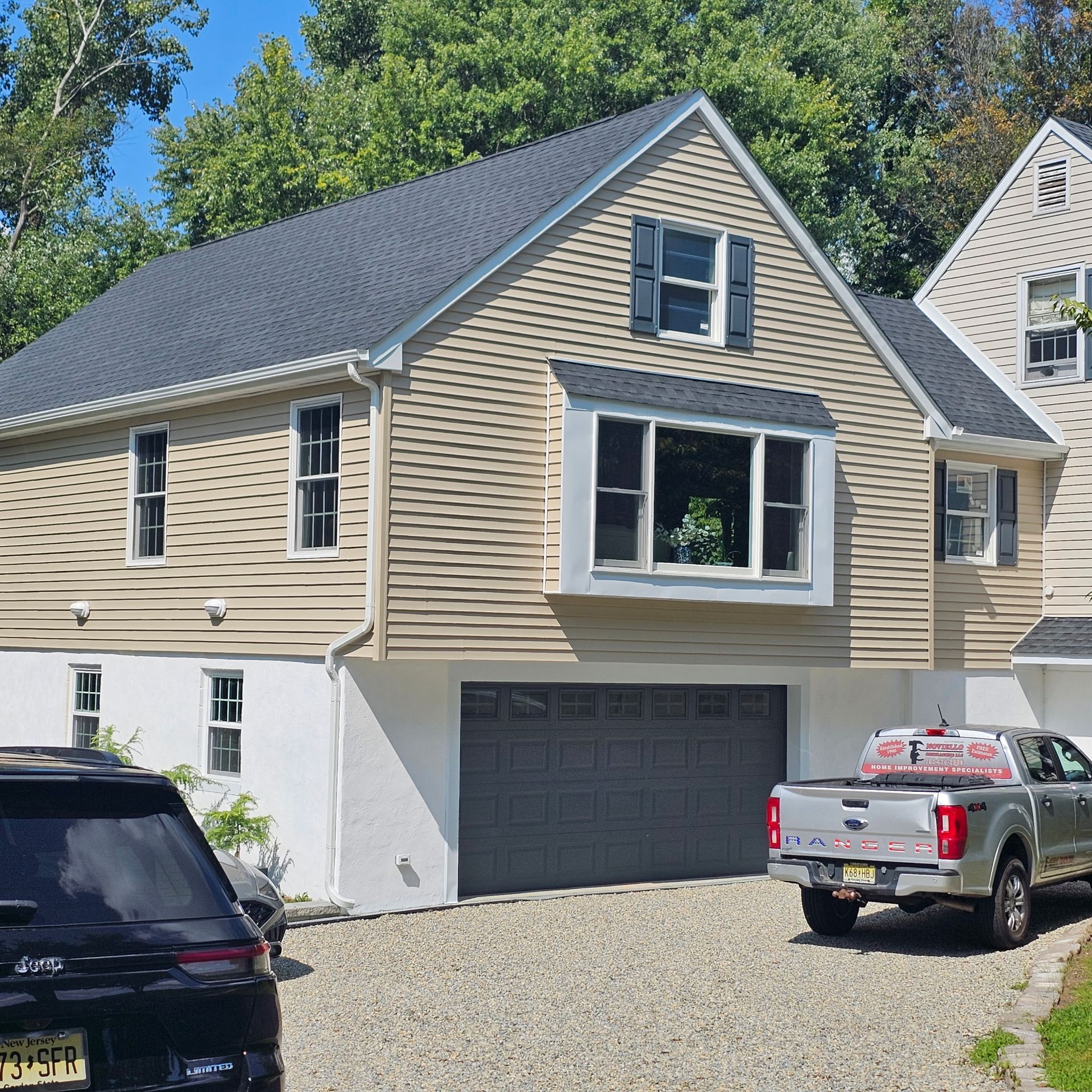 A ford truck is parked in front of a house