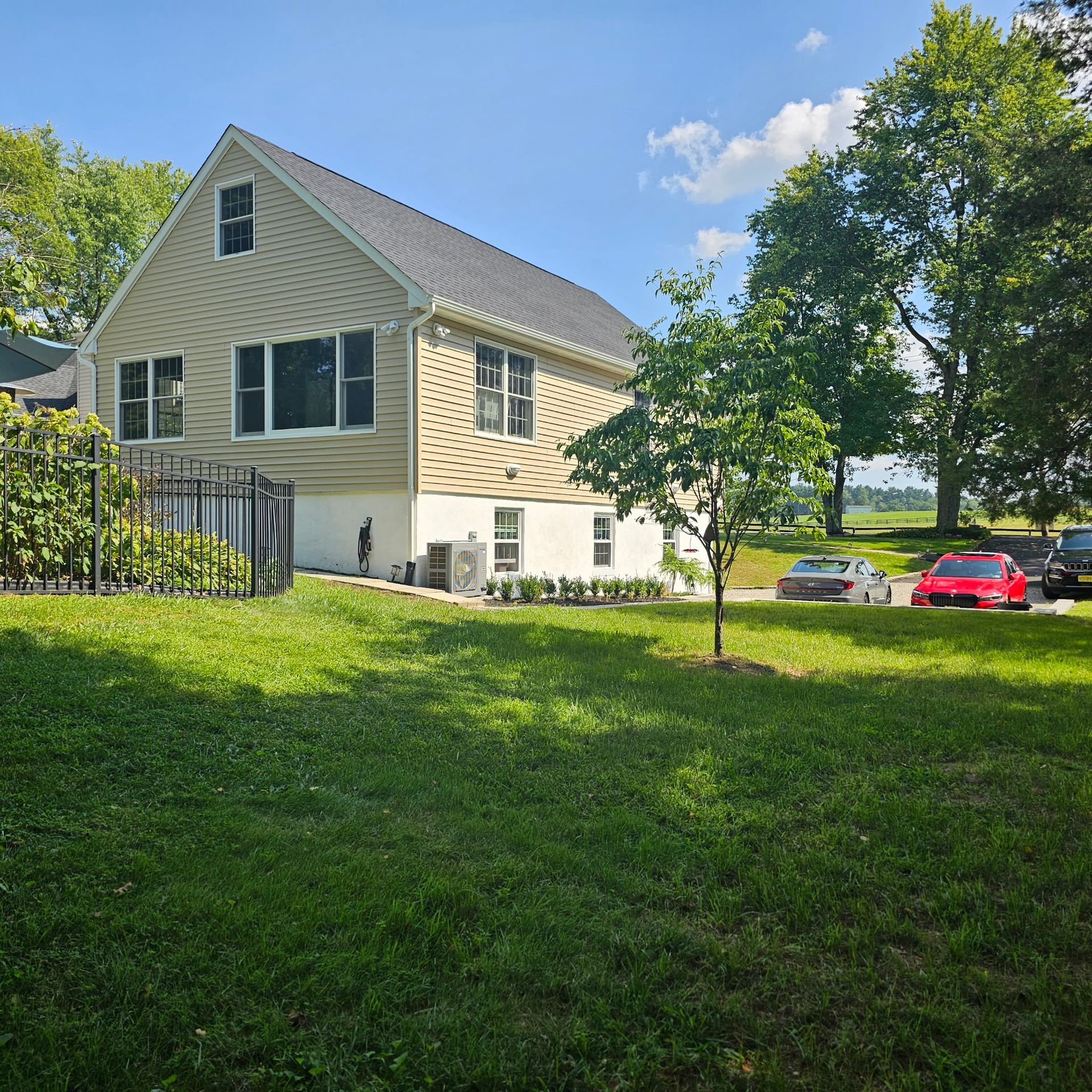 A house with a lot of grass in front of it