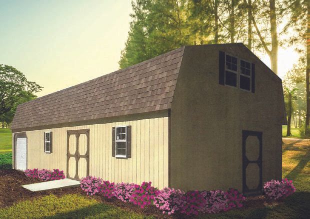 Tan shed with a brown barn-style roof, two doors, and a small porch, with flowers in front and trees in the background.