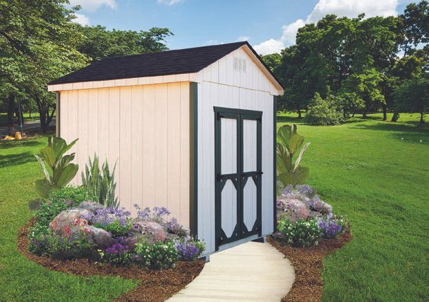 White shed with black trim and door, path, and flower garden in a green lawn setting.