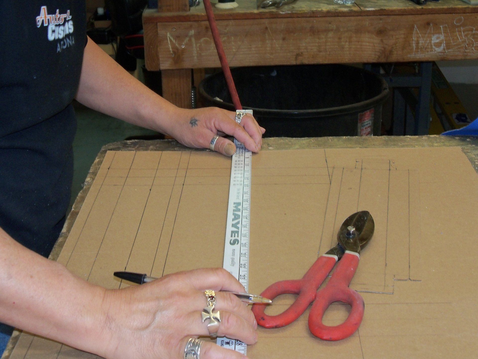 Man measuring with card board