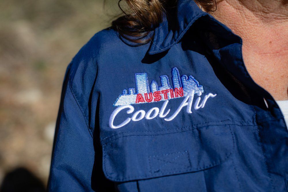 Blue shirt with Austin Cool Air logo