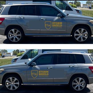 Two gray SUVs with Storm Shield logo; parked next to a white van outdoors.