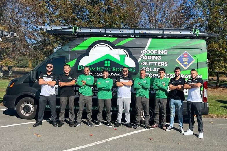dream home roofing team in front of the van