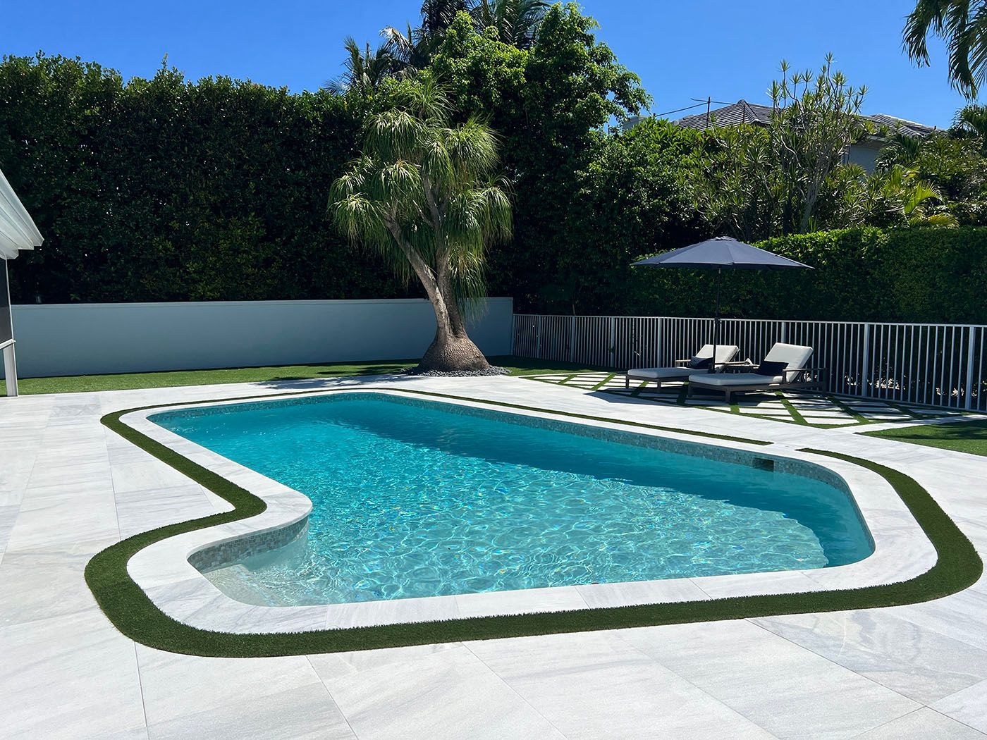 A large swimming pool in a backyard