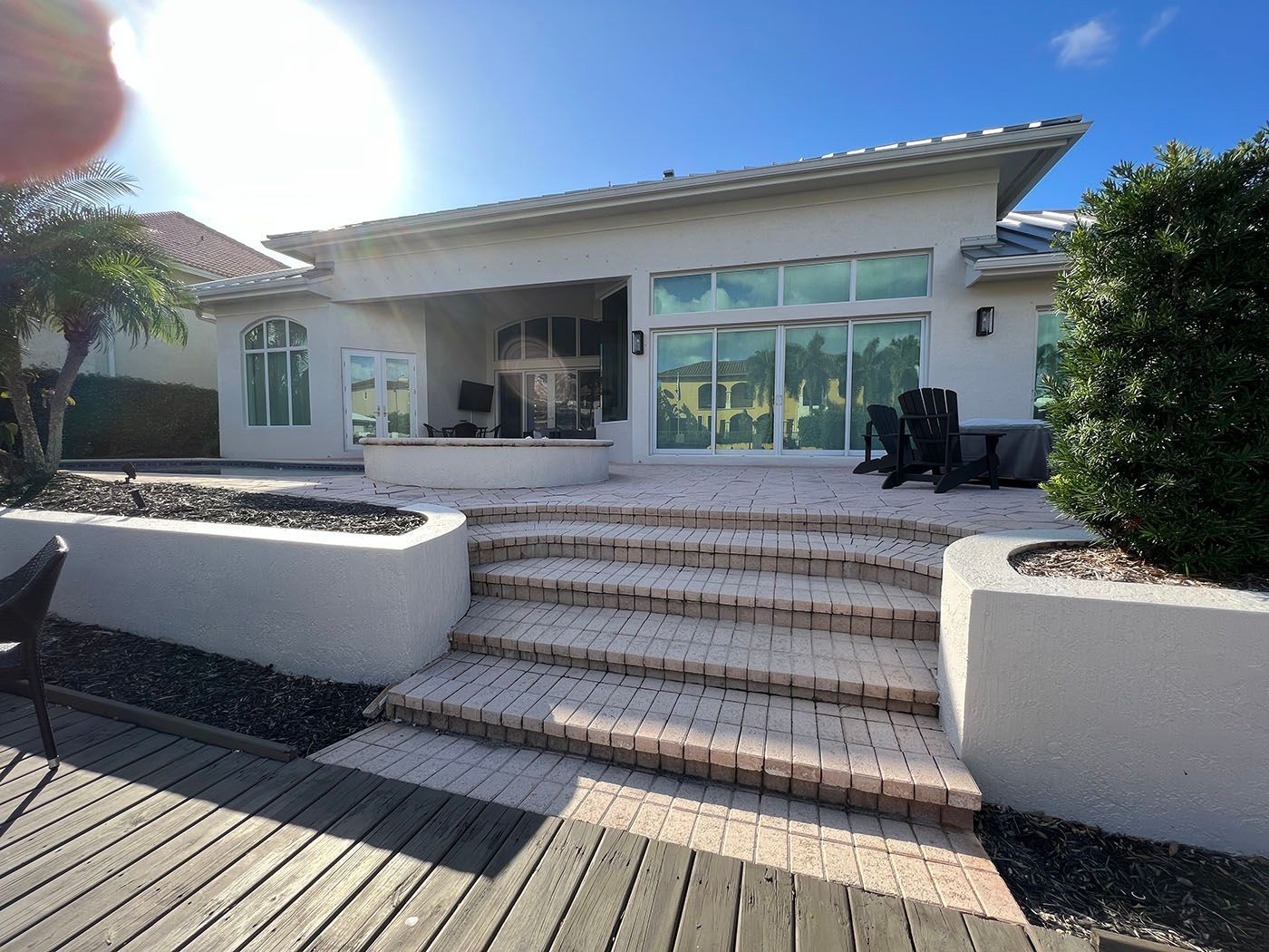 A white house with stairs leading up to it