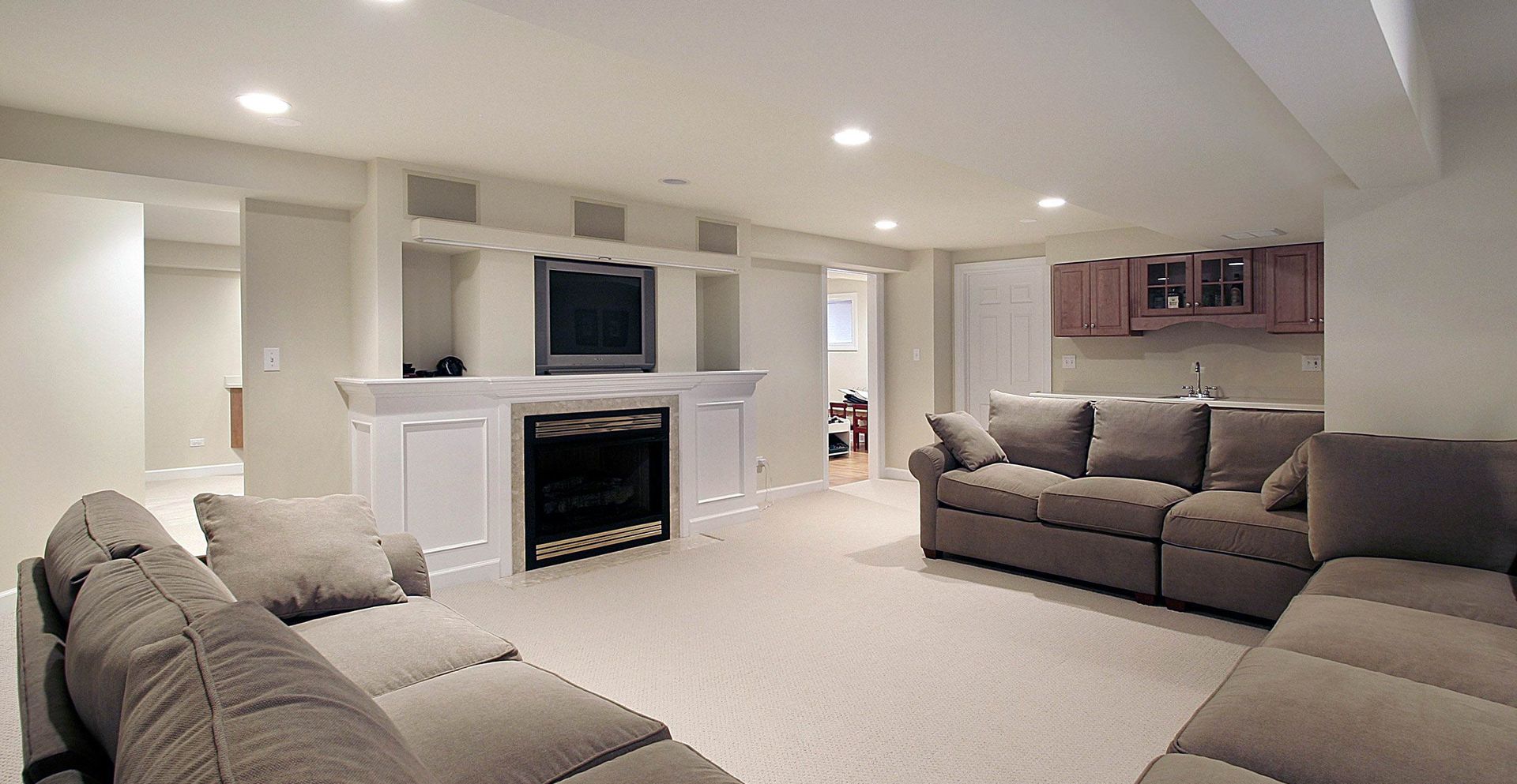 A living room with a couch and a fireplace