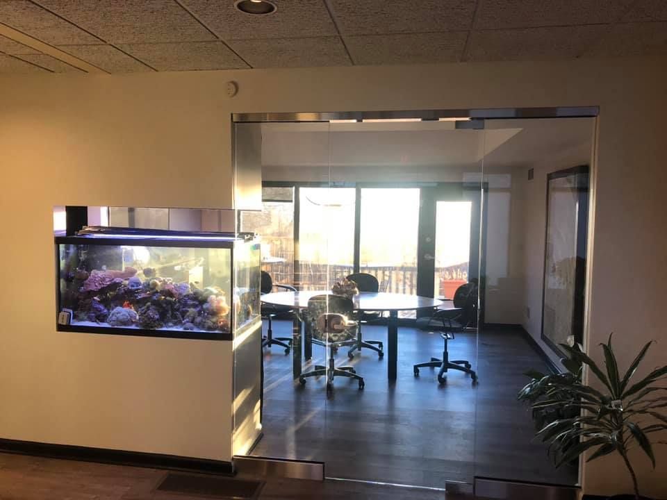 A conference room with a fish tank in the corner