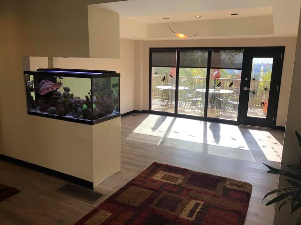 There is a large aquarium in the middle of the room.