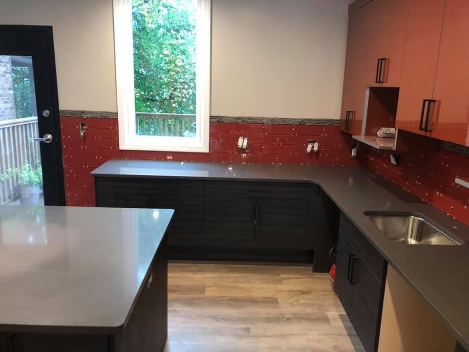 A kitchen with a large island and a sink
