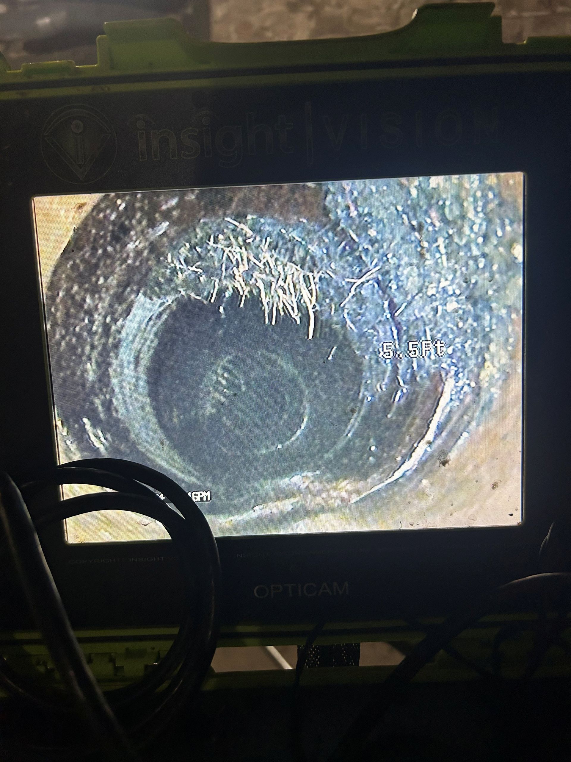 A computer monitor shows a picture of a hole in the ground.