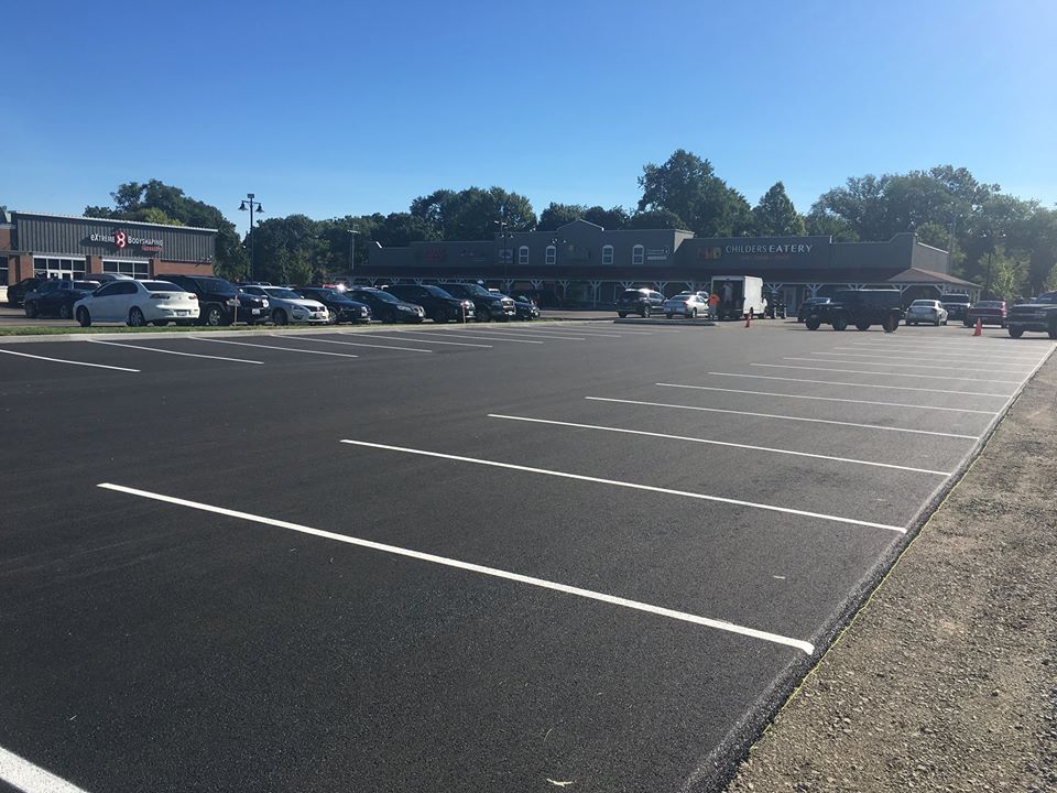 A lot of cars are parked in a parking lot