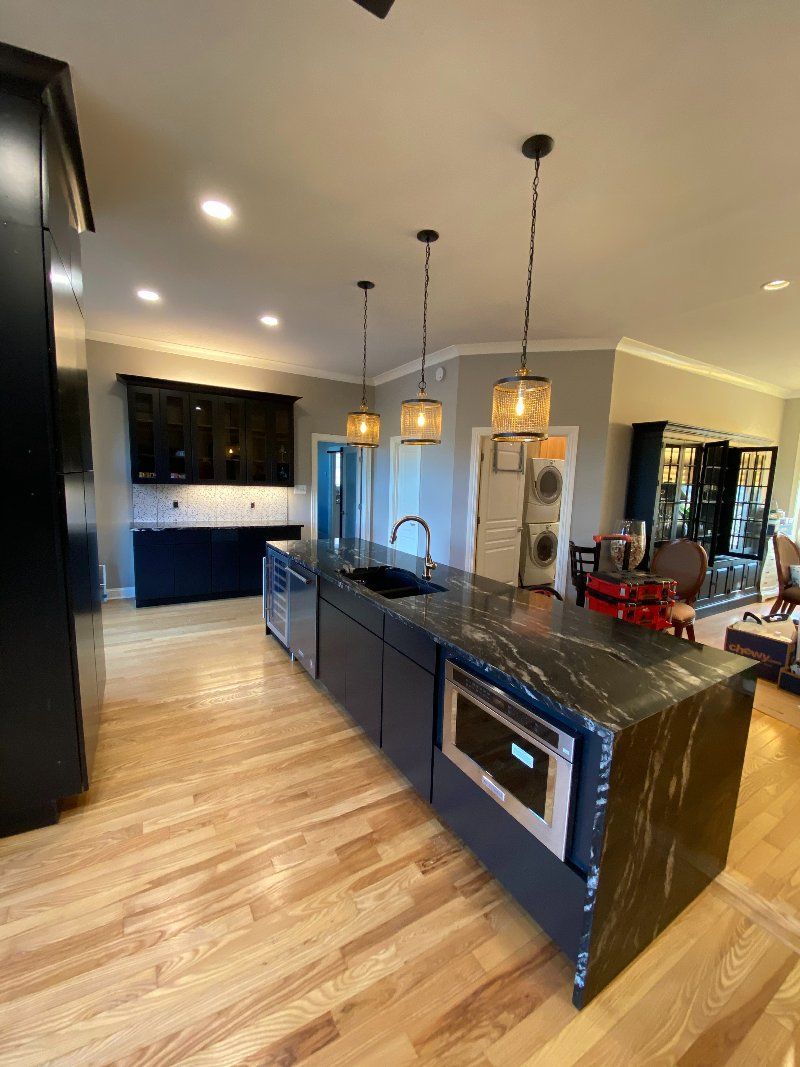 There is a large island in the middle of the kitchen.