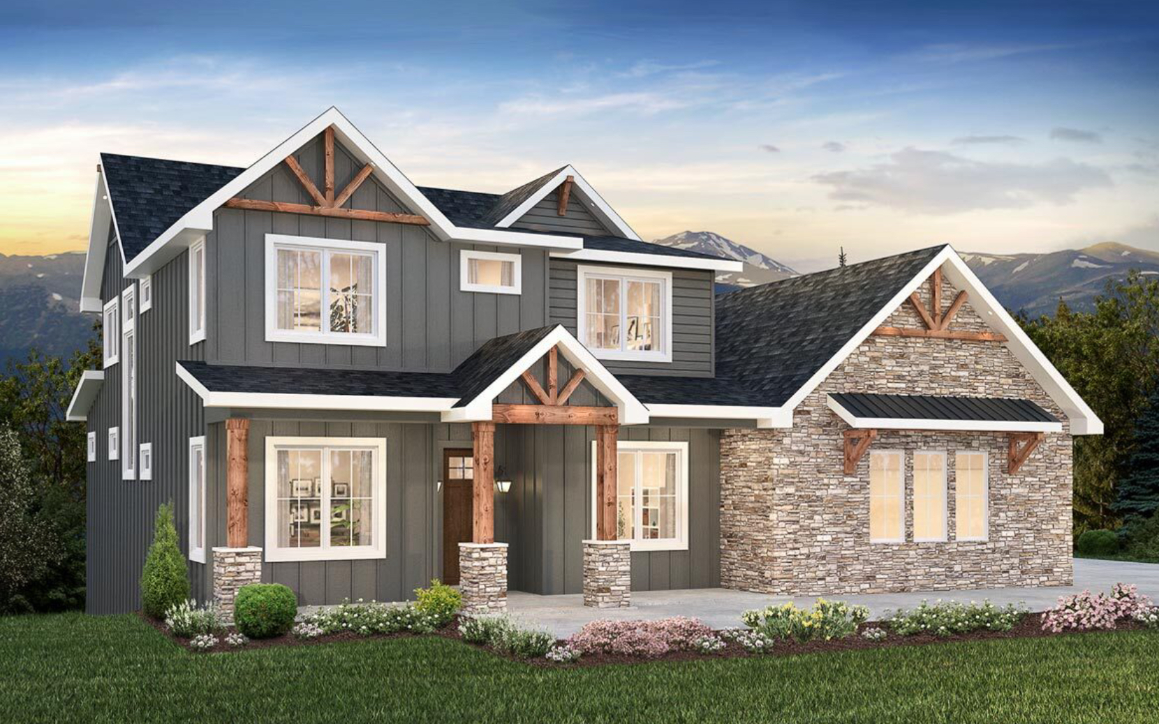 A large house with a lot of windows and a stone facade is sitting on top of a lush green field.