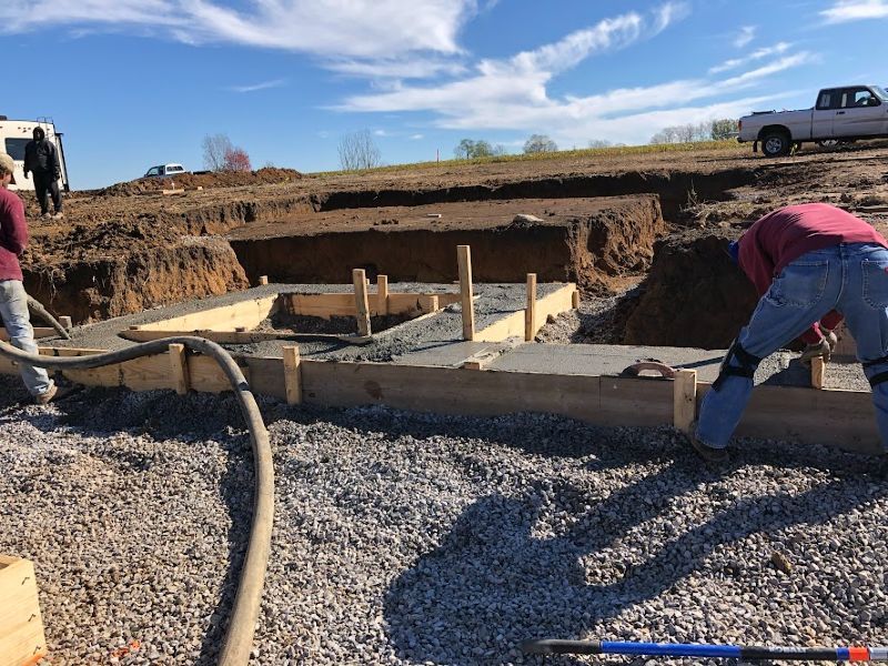 A group of construction workers are working on a construction site.