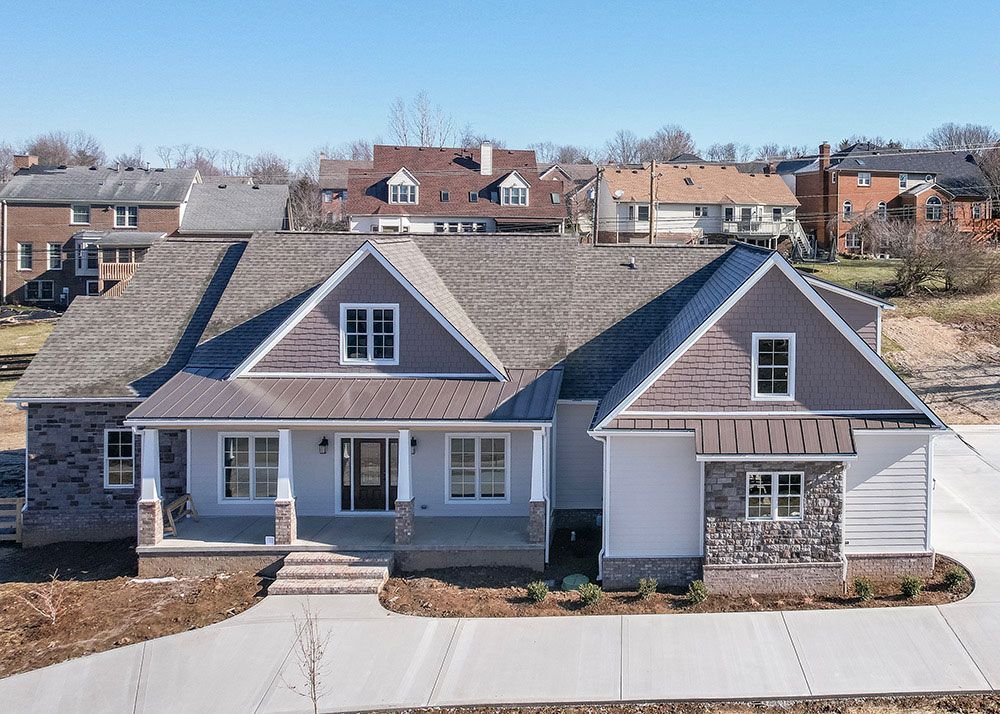 An aerial view of a house in a residential area