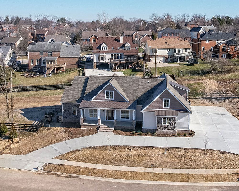An aerial view of a house in a residential area