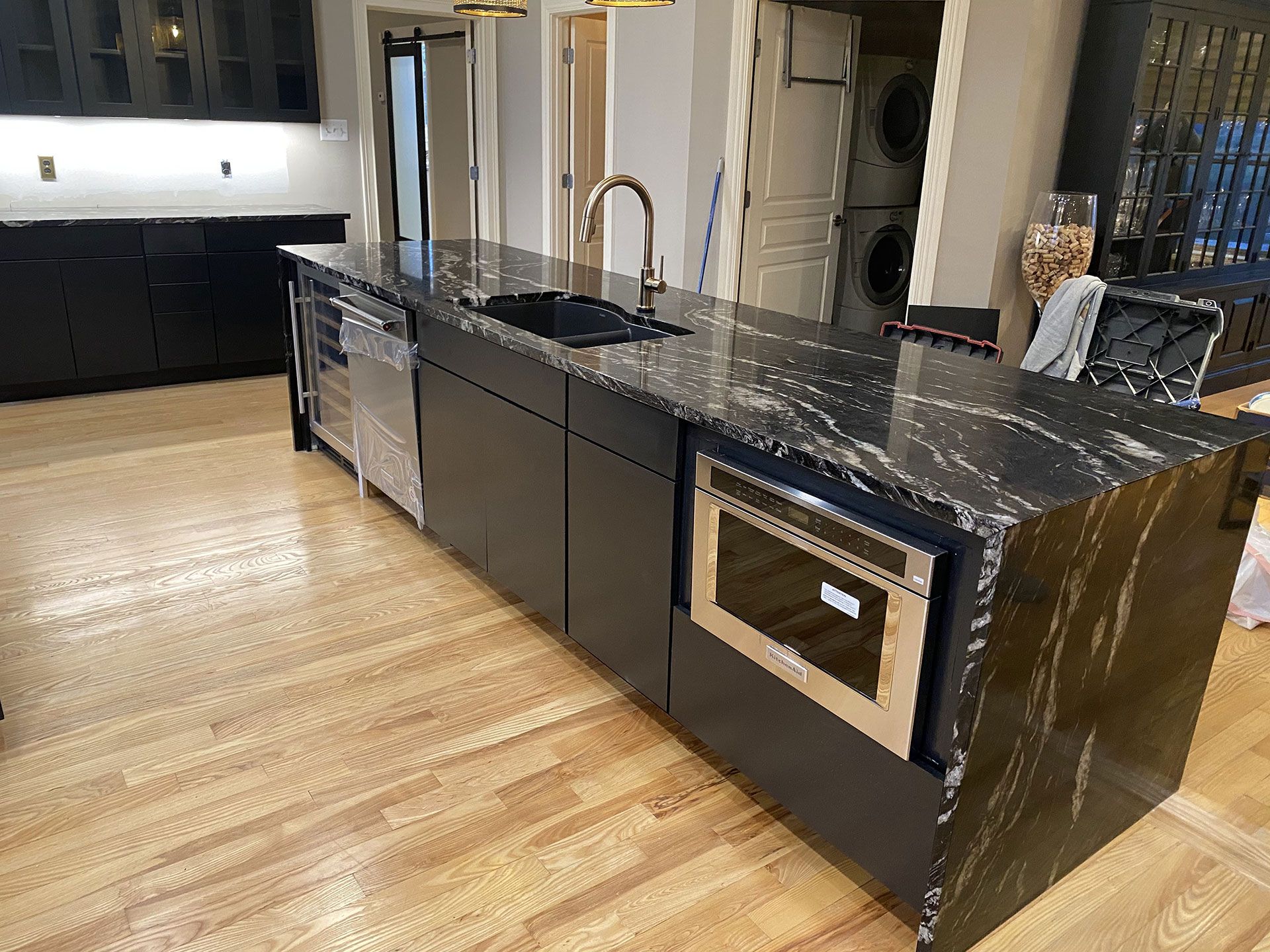 There is a large island in the middle of the kitchen