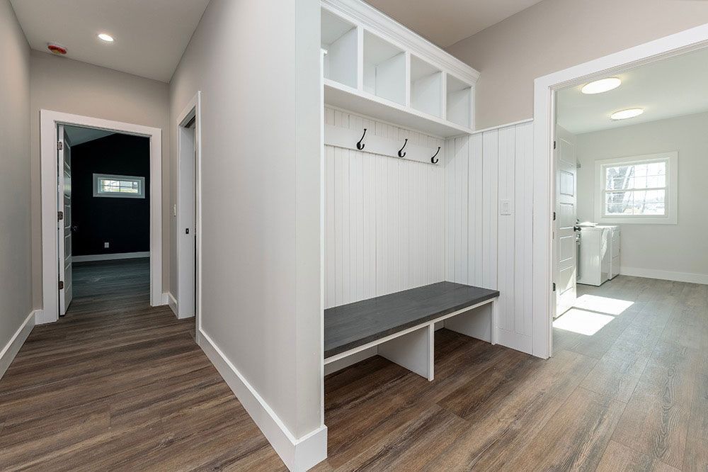 There is a bench in the middle of the hallway