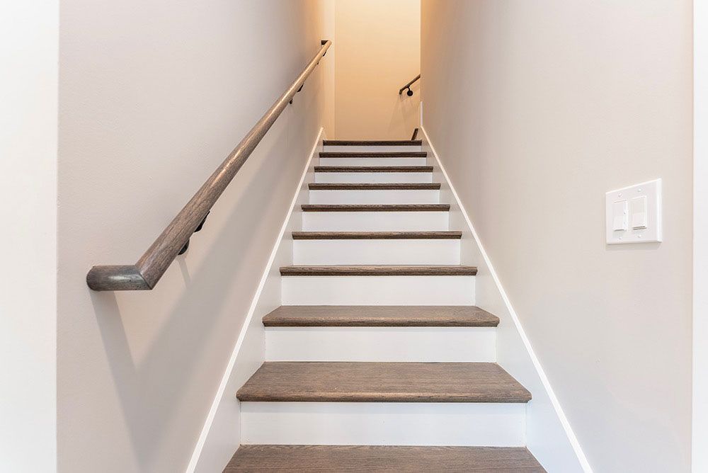 A set of stairs leading up to the second floor of a house
