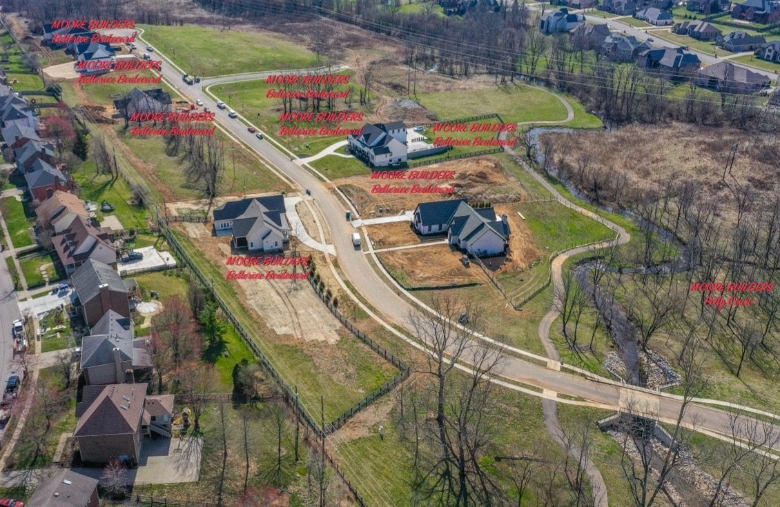 An aerial view of a residential area with lots of houses and trees.