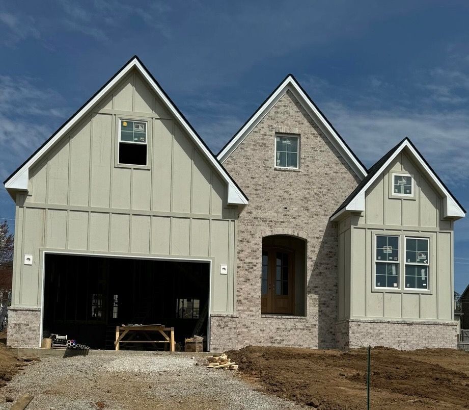 A house that is being built with a large garage