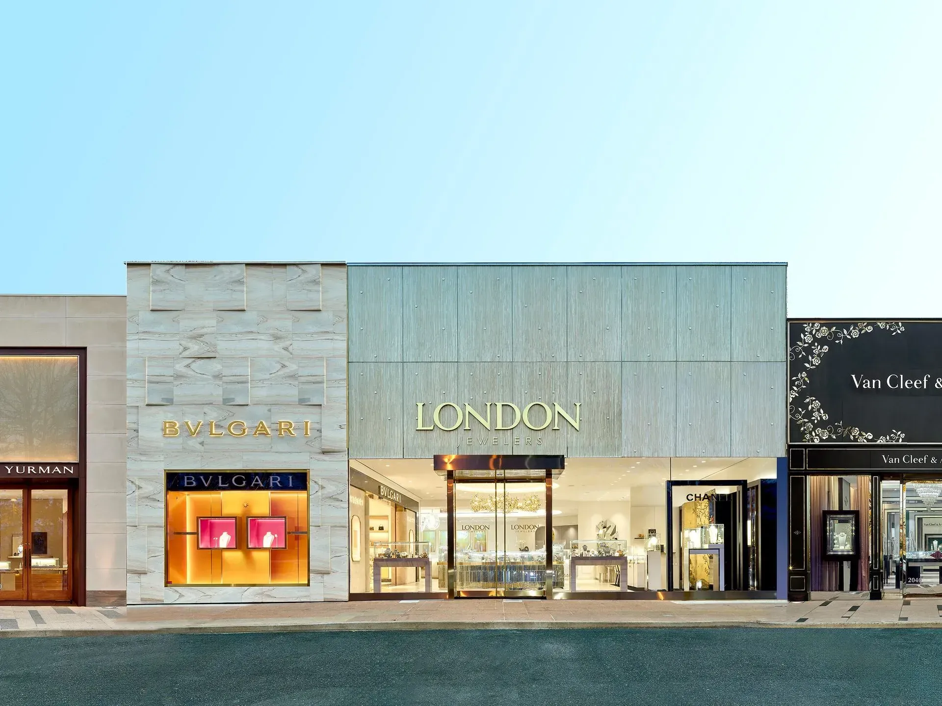 Exterior of luxury shops in London, featuring the Bulgari and London store fronts.