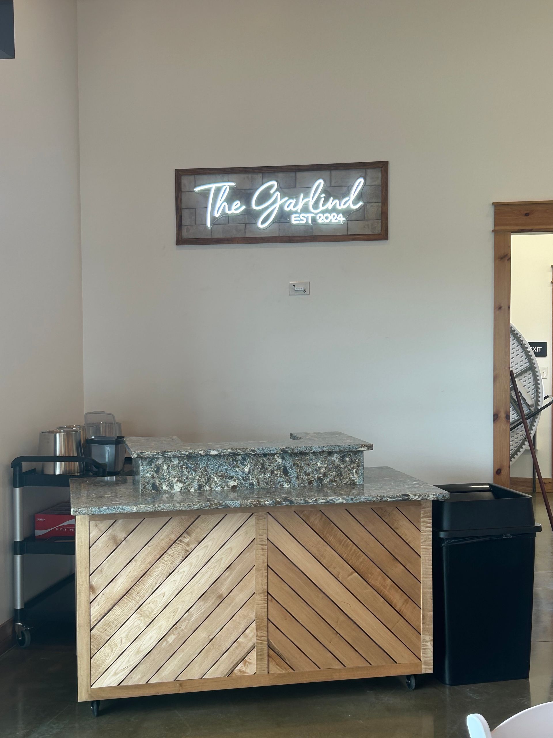 Bar with a stone countertop and wood front, 