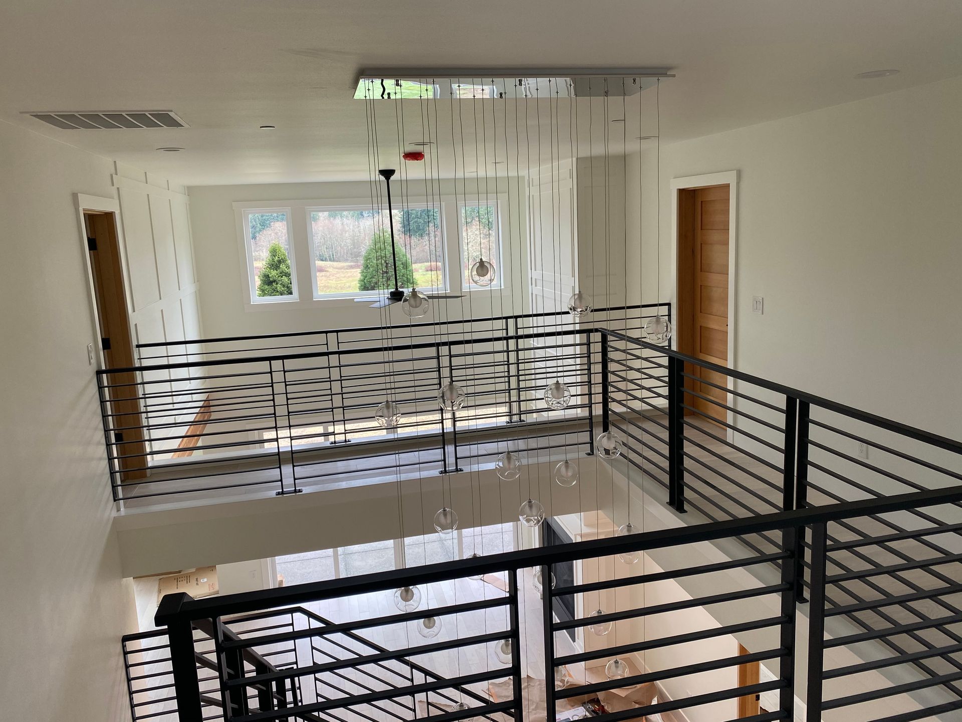 A view of a staircase from the second floor of a house