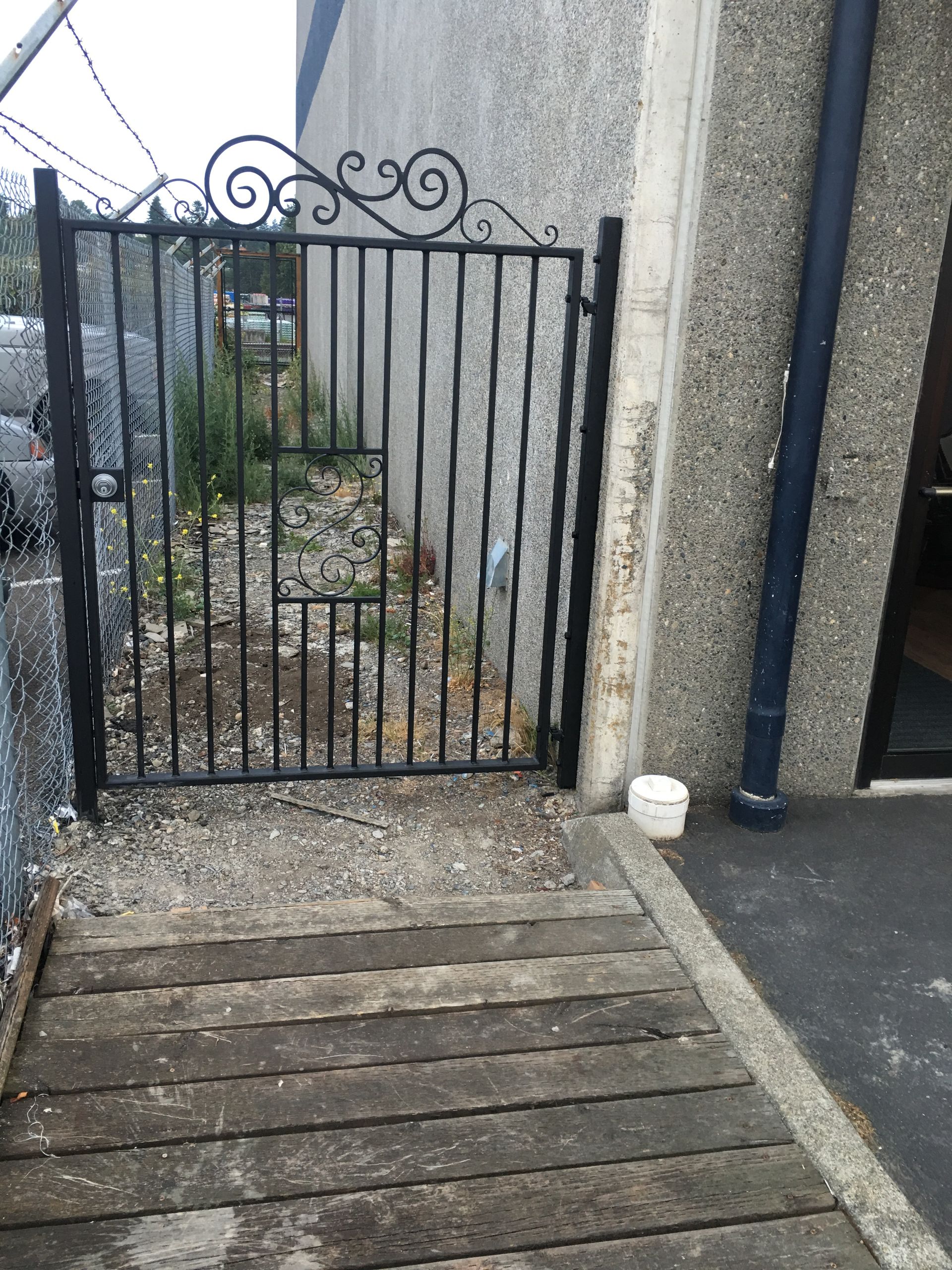 The front door of a house with a wrought iron gate