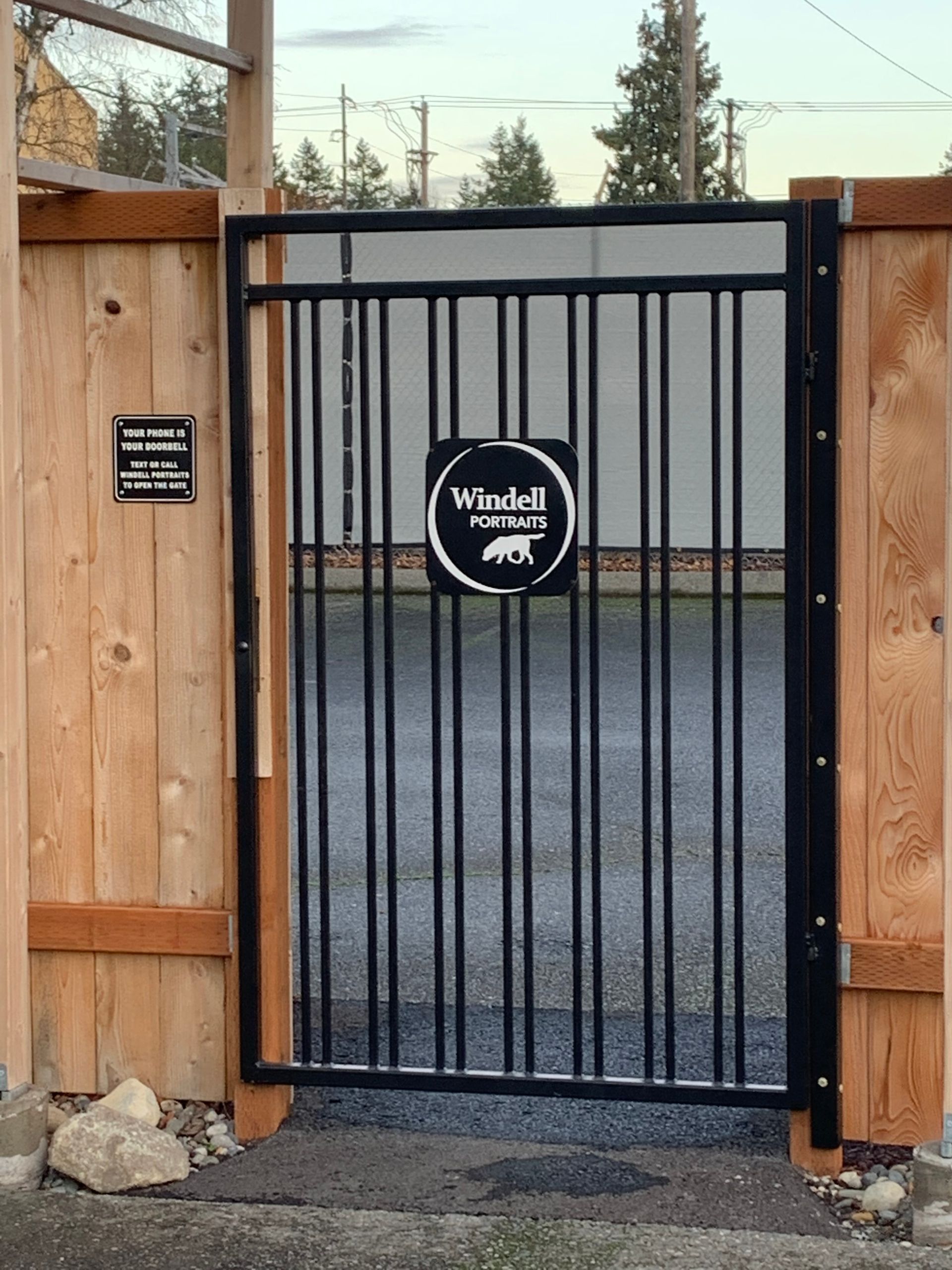 A metal gate with a sign on it that says windell