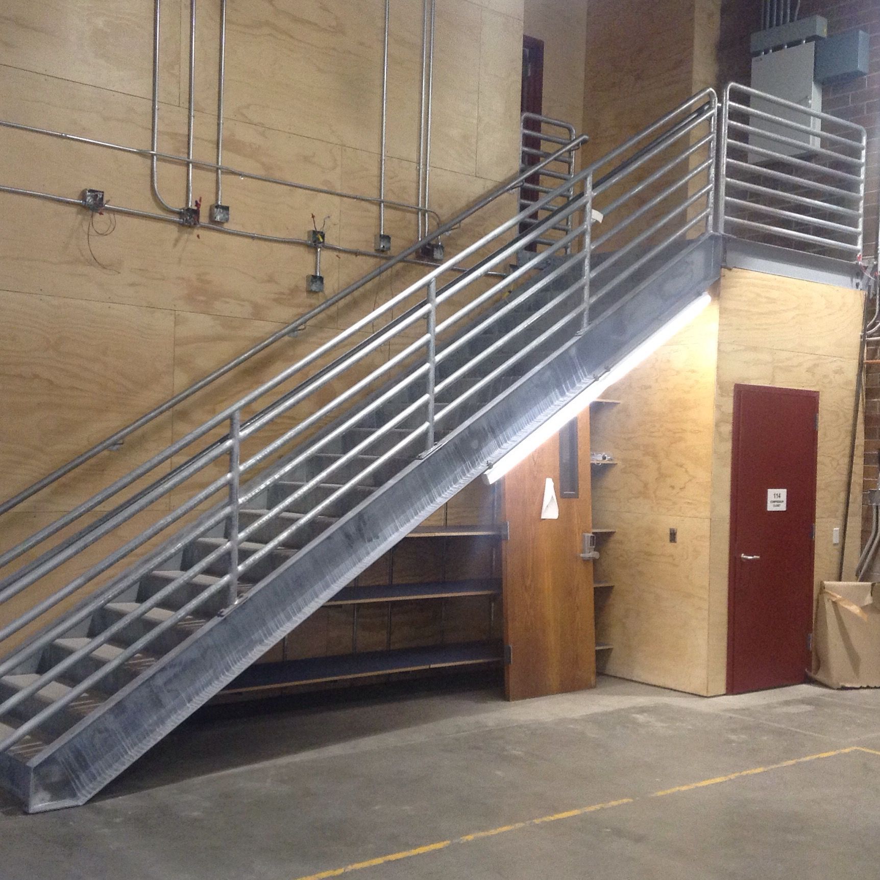 A staircase in a building with pipe railing