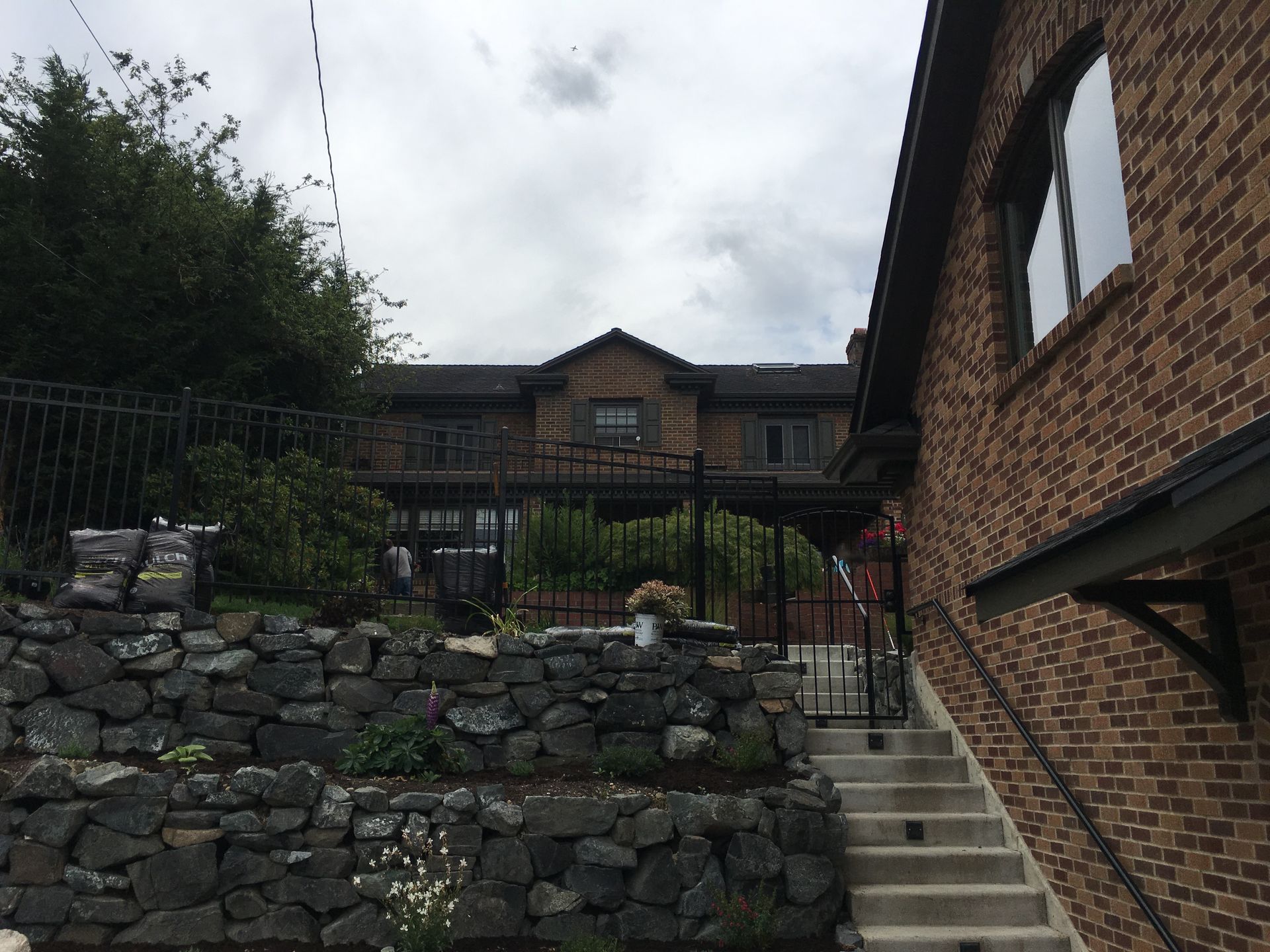 A large brick building with stairs leading up to it