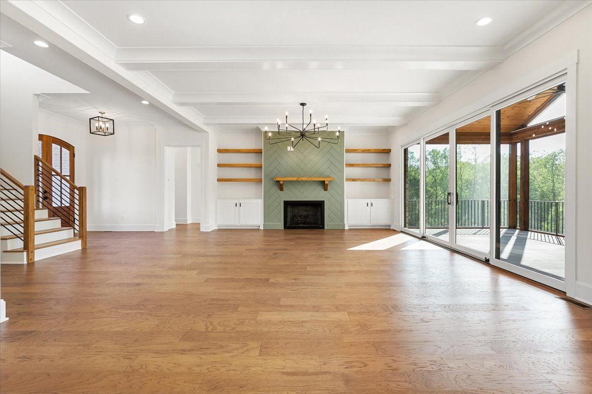 An empty living room with white walls