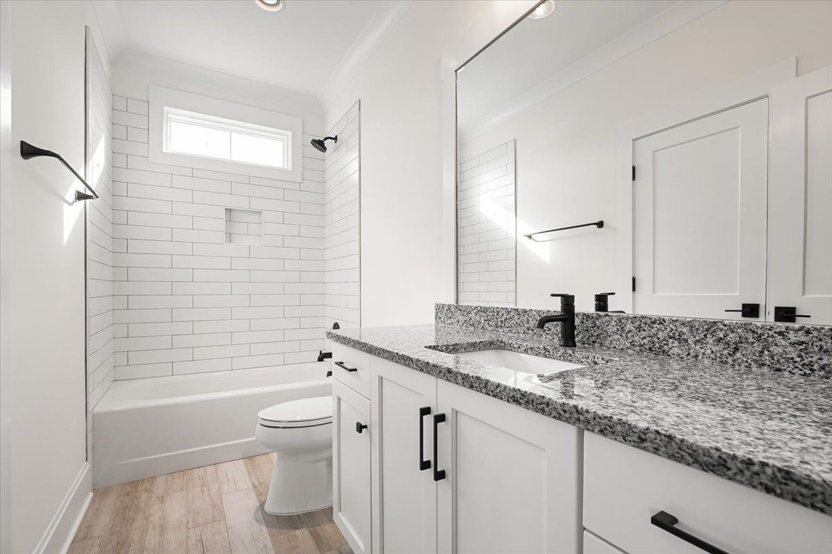 Bathroom with white walls and marble countertop