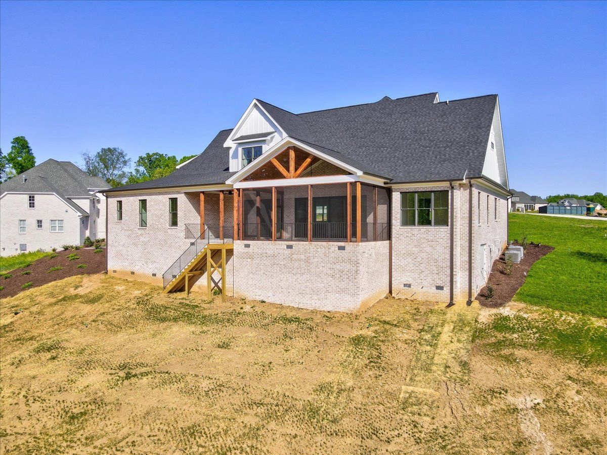 The back of a house with a large yard