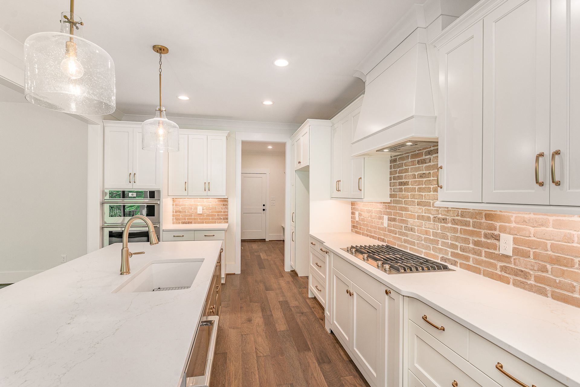 White kitchen cabinets with gold hardwares