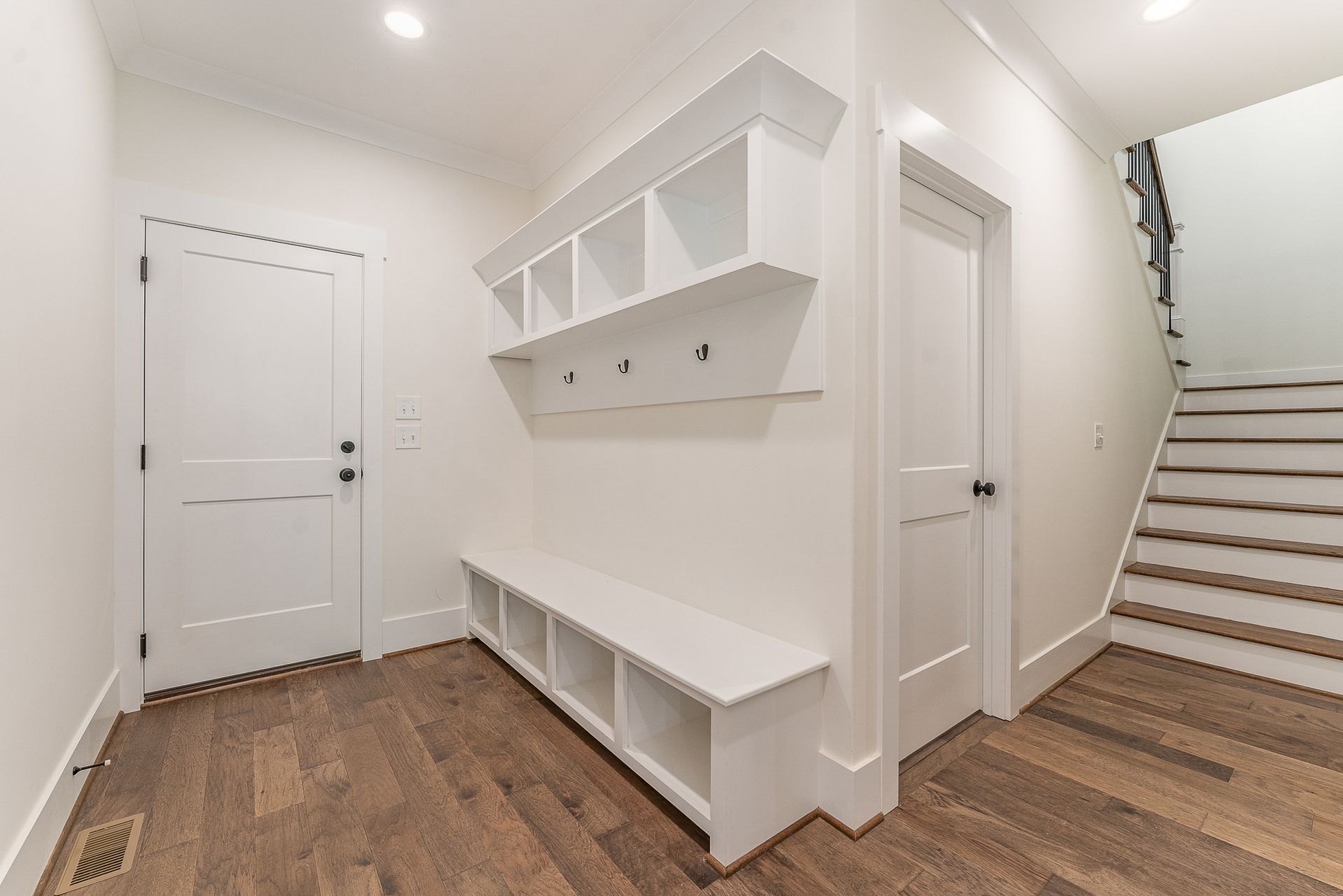 A room with a bench and stairs