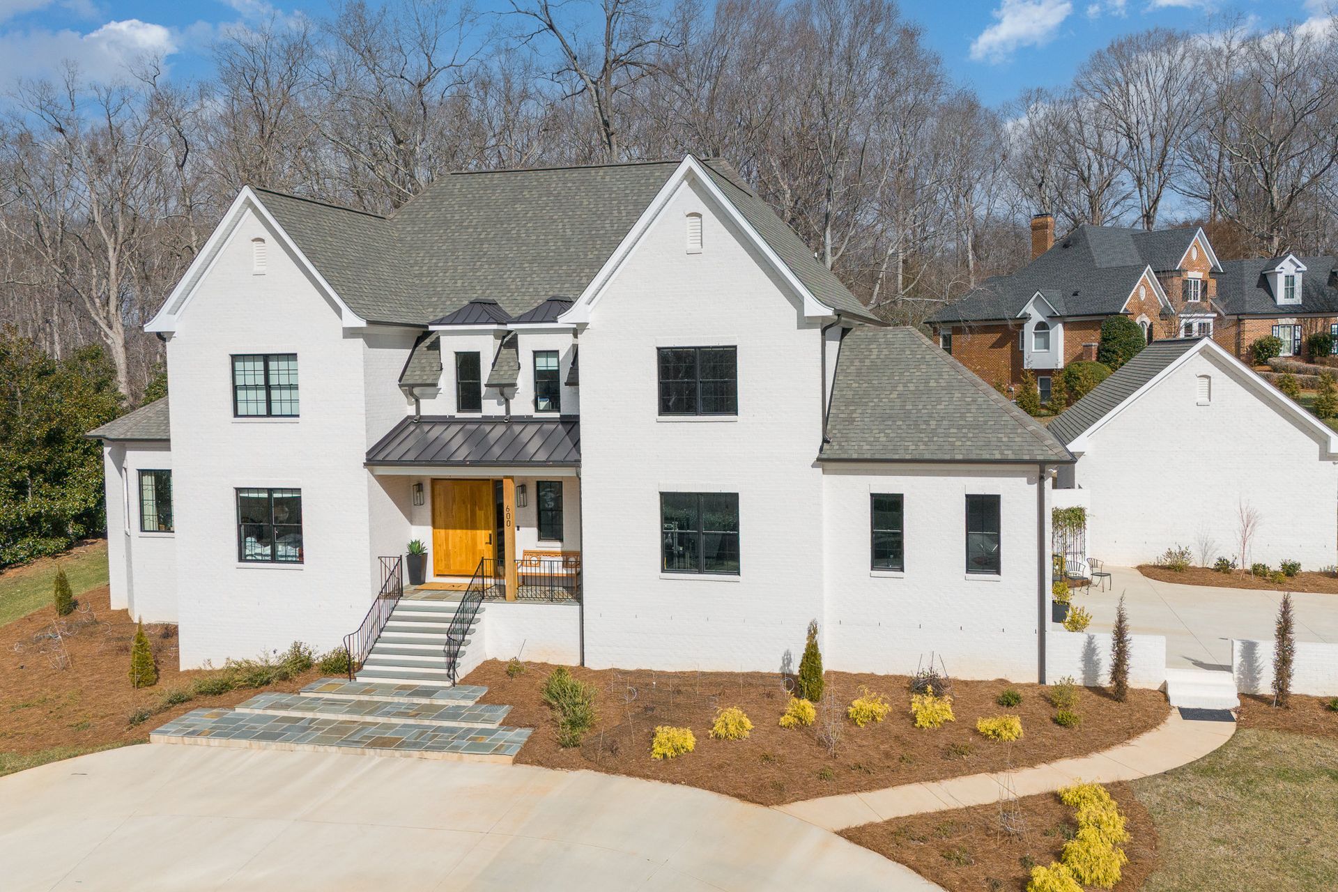 A large white house with a wooden door