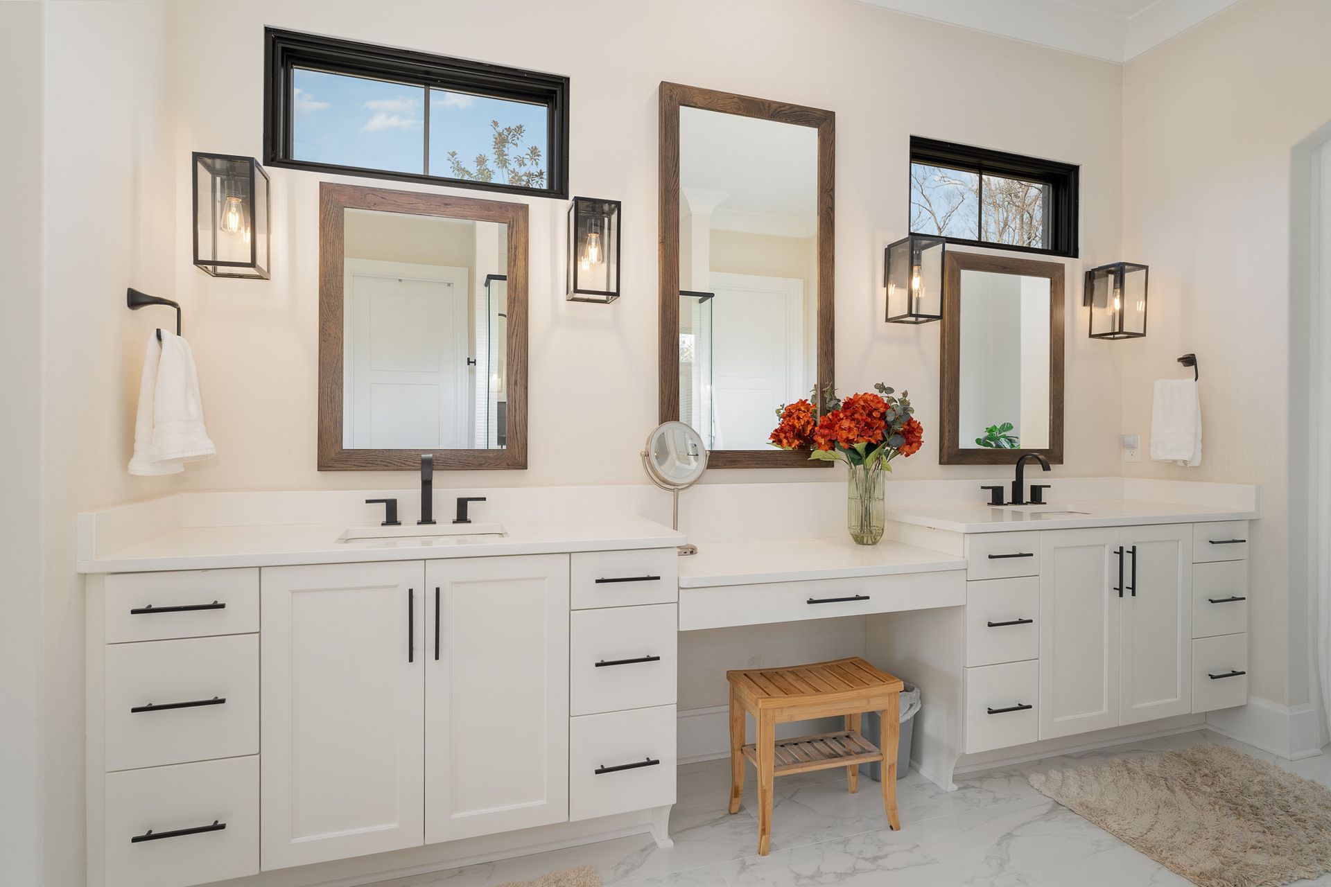 Vanity area with two sinks and mirrors