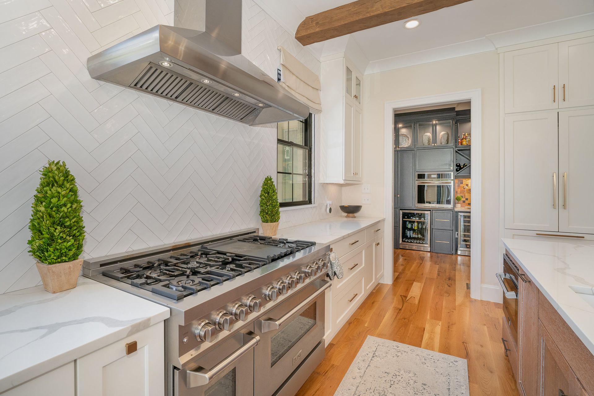 Kitchen with stainless steel appliances and white cabinets
